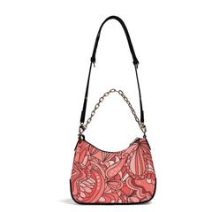 Stylish coral pink designer handbag with intricate floral patterns and elegant gold chain accent