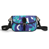 Kume Colorful geometric patterned flap bag with blue, purple, teal, and white abstract design, black trim and strap, gold hardware. Retro Chic Blissfully Brand