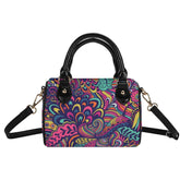 Juhla Boston Satchel barrel handbag with psychedelic floral print in turquoise, pink, and orange with black faux leather handles and adjustable strap - Retro Chic - Blissfully Brand