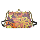 Vibrant Aki print textured Nappa leather metal frame clutch with gold chain strap and colorful abstract floral design - Blissfully Brand