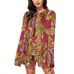 Colorful boho-chic women's pajama set with long-sleeved top and shorts featuring vibrant abstract floral pattern in red, pink, green, and orange