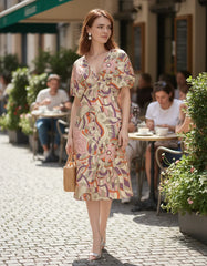 Amai printed boho dress by Blissfully Brand in a colorful beige pink abstract floral pattern and V-neck. Retro Chic