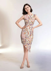 Amai dress by Blissfully Brand featuring asymmetrical hemline and vibrant abstract floral-inspired patterns.