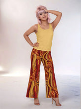 Ame print palazzo pants in red, orange, and gold hues. Retro Tribal Influenced print - Bold Vibrant Chic Wide leg trousers for women - Profonde by Blissfully Brand