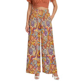 Blissfully Brand Binka Print High Waist Wide Leg Silky Pants in bold psychedelic amber, terracotta, periwinkle and lavender swirl pattern — worn with terracotta crop top