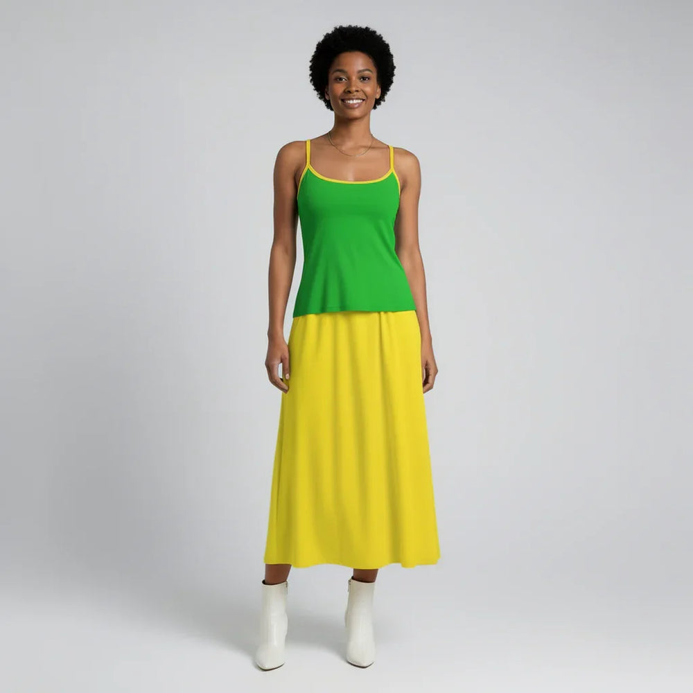 Full length outfit featuring dark pastel green fitted cami top with yellow trim paired with canary yellow pleated midi skirt - Lemon Lime Cami Top and skirt styling by Blissfully Brand