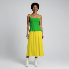 Full length outfit featuring dark pastel green fitted cami top with yellow trim paired with canary yellow pleated midi skirt - Lemon Lime Cami Top and skirt styling by Blissfully Brand