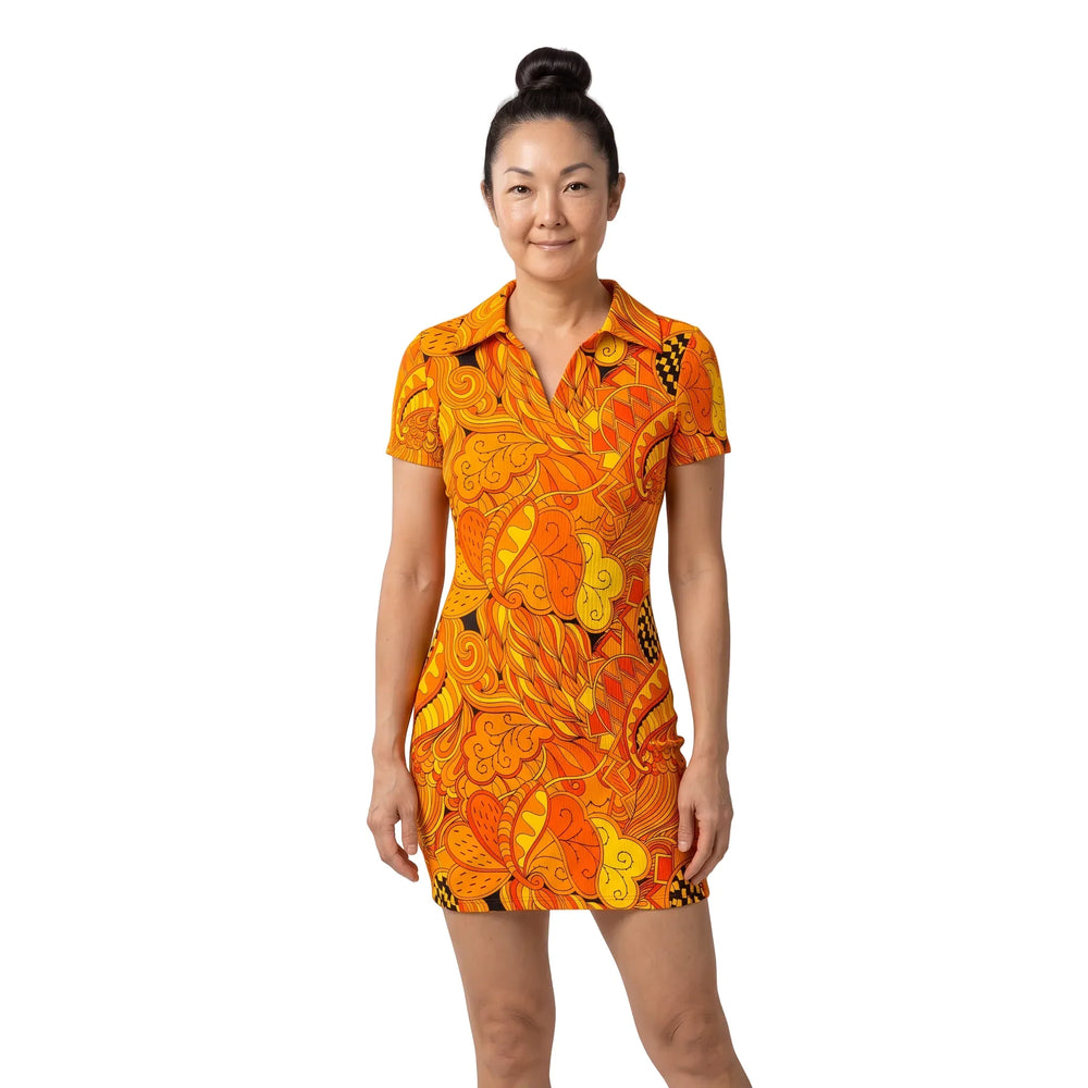 Woman wearing the Mandra Print Ribbed Polo Bodycon Mini Dress, with a retro orange and yellow paisley floral print, polo collar, and short sleeves - Blissfully Brand