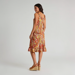 Back view of Miarna print dress showing ruffled neckline, spaghetti straps, and ruffle hem with retro floral print - Blissfully Brand relaxed fit dress
