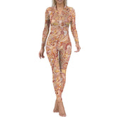 Vibrant Mikani print jumpsuit with abstract swirling patterns in warm orange, pink, and beige tones, featuring long sleeves and a form-fitting design. Psychedelic Retro - Blissfully Brand