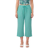 Woman wearing Puerto Rico Green wide-leg capri pants with Persian Green drawstring tie and Mima print tube top - Blissfully Brand Solid Series