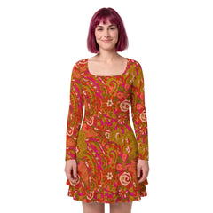 Woman wearing Mina print long sleeve ruffle hem mini dress in moss green, coral, and magenta retro pyschedelic paisley pattern - Blissfully Brand