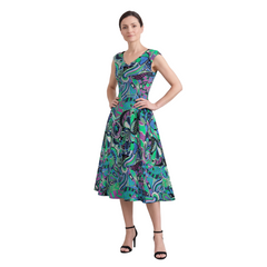 Woman wearing Nela print emerald and cobalt fit and flare midi dress with pockets, Profonde Collection by Blissfully Brand