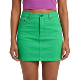 Nela Solid Series Spring Green Flexe Denim Mini Skirt with polished zip chain closure and black metal hardware, styled with Mulberry Violet crop top