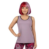 Pena Women's solid scoop neck tank top in Violet Bouquet lavender color, paired with patterned leggings for a stylish, coordinated look. - Blissfully Brand