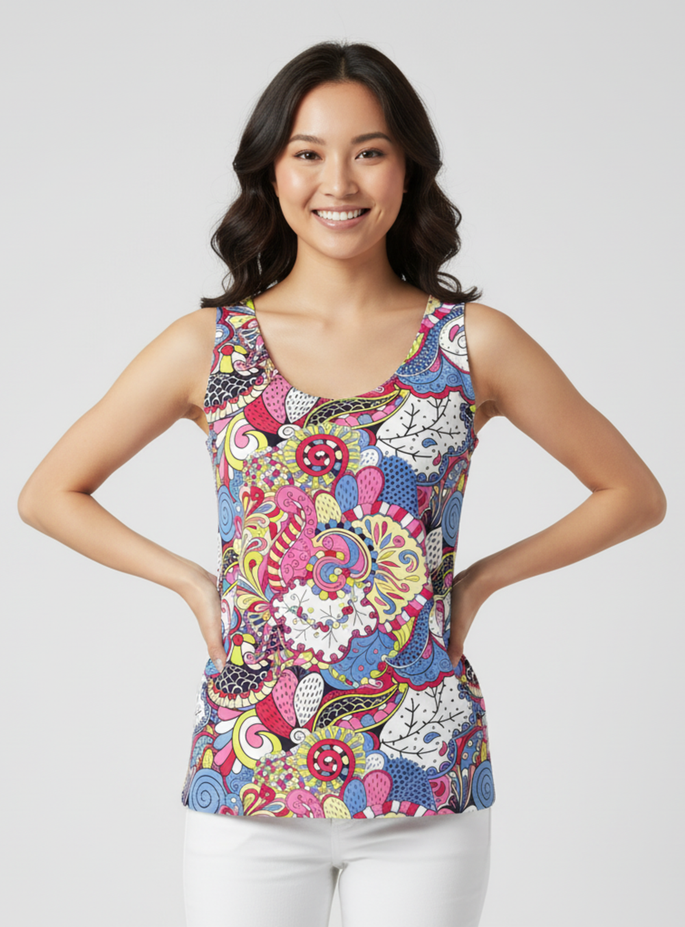 Sechia print round neck tank top featuring vibrant psychedelic florals in hot pink, cobalt blue, chartreuse and crimson, paired with white jeans — Profonde Collection by Blissfully Brand, made to order in Montreal