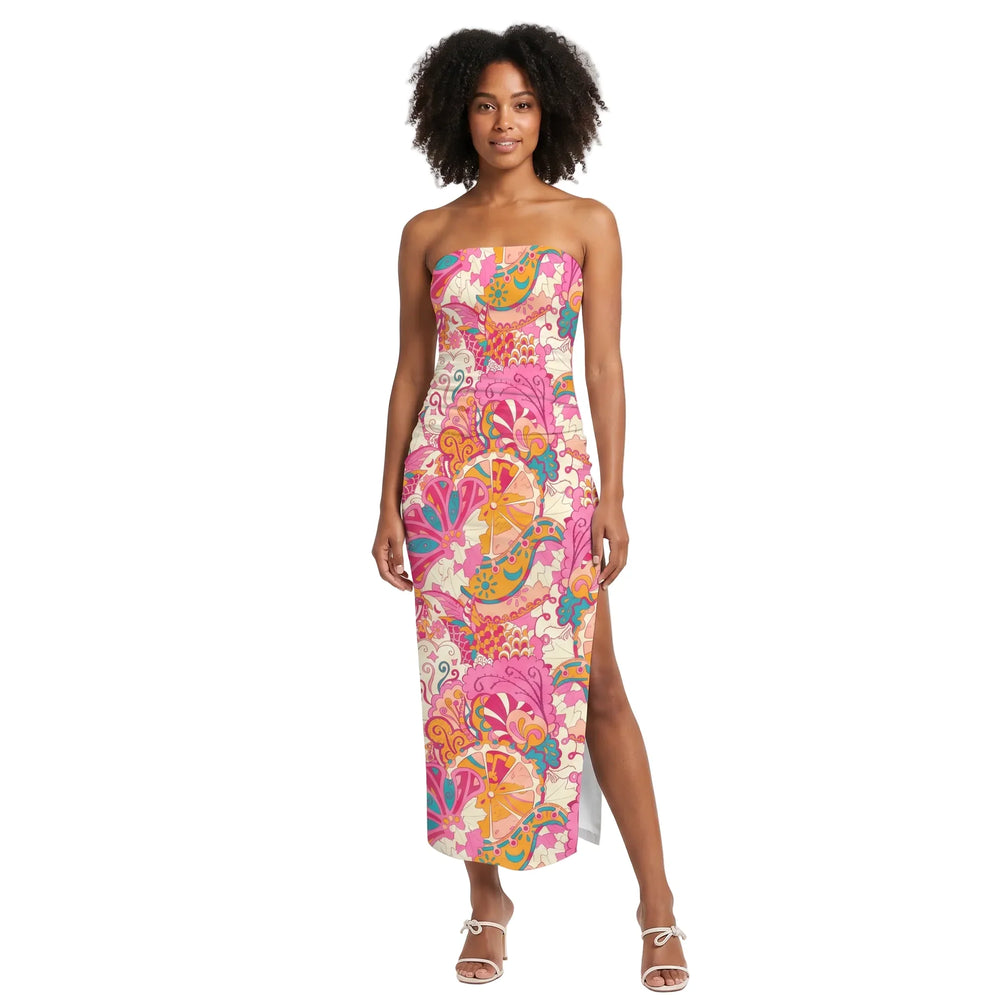 Woman wearing Sameri print strapless split-leg bodycon maxi dress in pink orange teal paisley print with white strappy heels - Blissully Brand