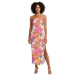 Woman wearing Sameri print strapless split-leg bodycon maxi dress in pink orange teal paisley print with white strappy heels - Blissully Brand