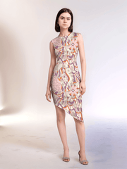 Amai dress by Blissfully Brand featuring asymmetrical hemline and vibrant abstract floral-inspired patterns.
