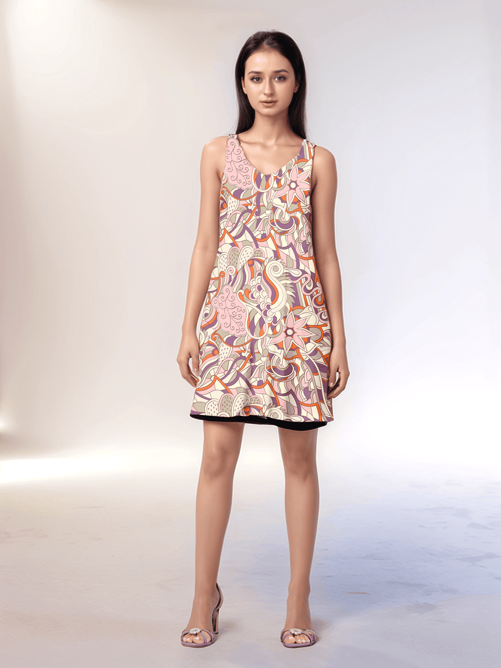 Amai reversible dress, featuring a vibrant retro floral and paisley print. The dress is a sleeveless mini-dress, and black reversed.