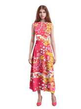 Vibrant and bold Decora maxi dress by Blissfully Brand in retro pink and yellow abstract print - perfect for making a chic statement with bold and vibrant colors with a vintage vibe.