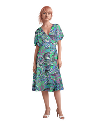 Bold and vibrant Nela dress by Blissfully Brand, featuring a retro chic design with a kaleidoscopic swirl of teal, purple, and green patterns, perfect for making a statement among bold, stylish dressers with a love for vintage-inspired flair.