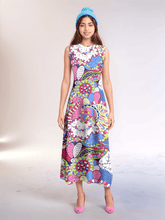 Bold retro chic Sechia dress by Blissfully Brand featuring a vibrant, multicolored abstract pattern with swirls, florals, and geometric shapes; sleeveless maxi dress silhouette designed for statement-making, confident dressers