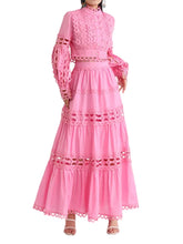 Pink eyelet lace two-piece ensemble featuring a high-neck crop top with bishop sleeves and a tiered maxi skirt with scalloped cut-outs, available in 4 colors - Blissfully Brand Jeans