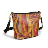 Ame print Nappa leather bucket bag in crimson, amber and burnt orange batik-inspired psychedelic print with gold hardware and adjustable black webbing strap — London Bliss Collection by Blissfully Brand