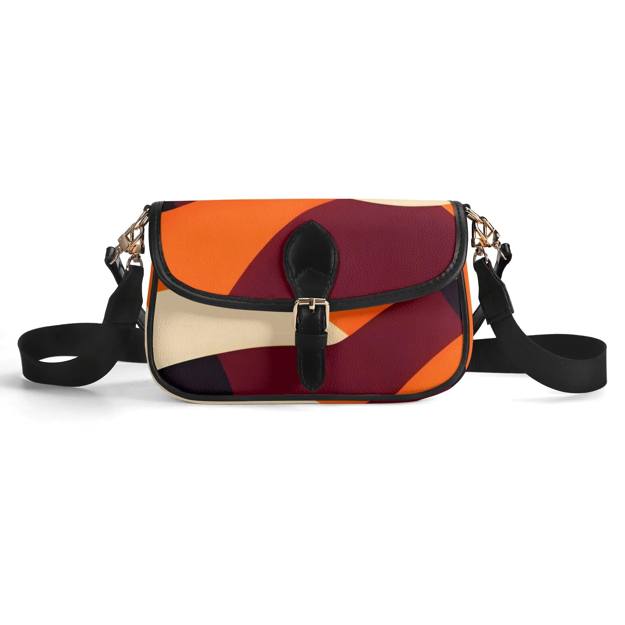 Colorful crossbody shoulder bag with retro geometric abstract orange, red, and beige design pattern and black adjustable strap