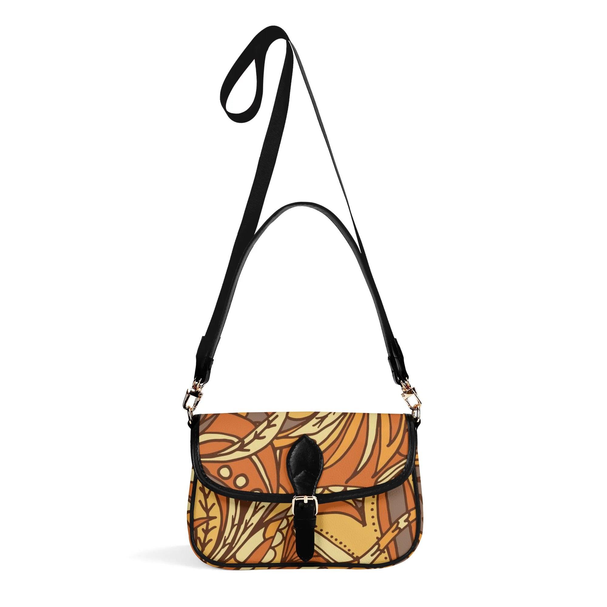 Stylish autumn-themed crossbody bag with artistic leaf pattern and adjustable black strap, showcasing trendy design for fall fashion accessories