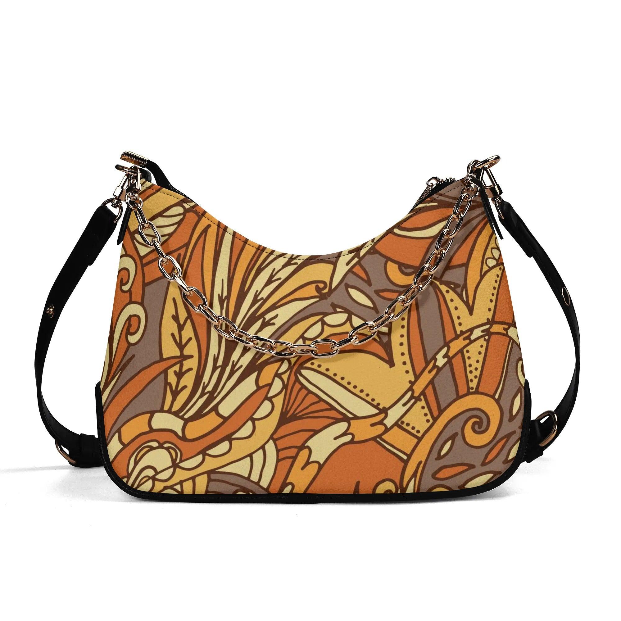 Stylish autumn-themed hobo bag with intricate paisley floral pattern and gold chain accent