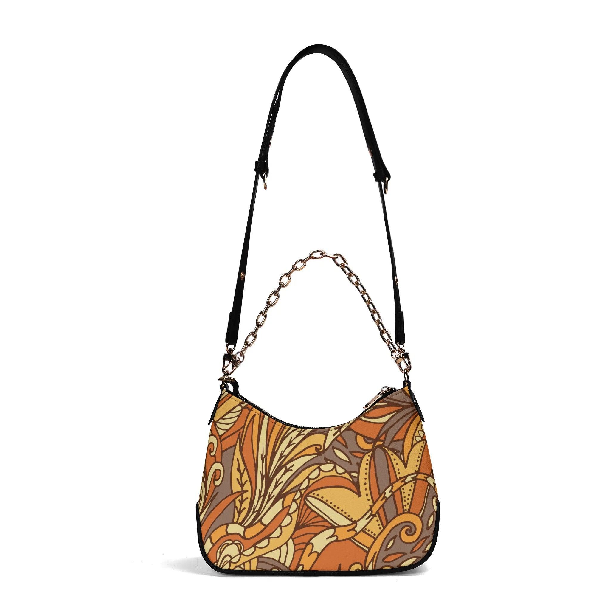 Stylish autumn-themed hobo bag with intricate paisley floral pattern and gold chain accent