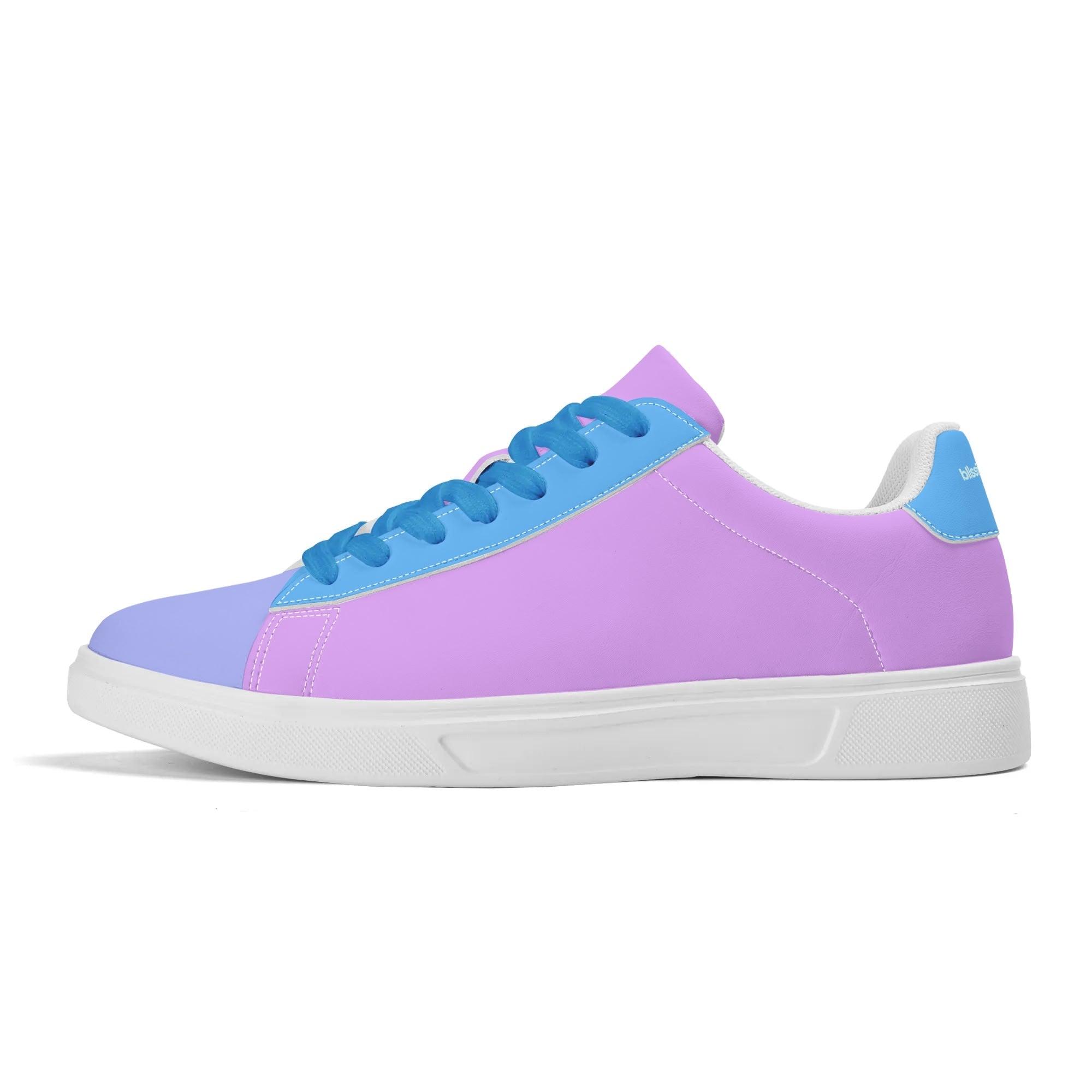 Women's pastel color-blocked sneakers with blue laces. The sneakers have a lavender and baby blue upper with a white sole