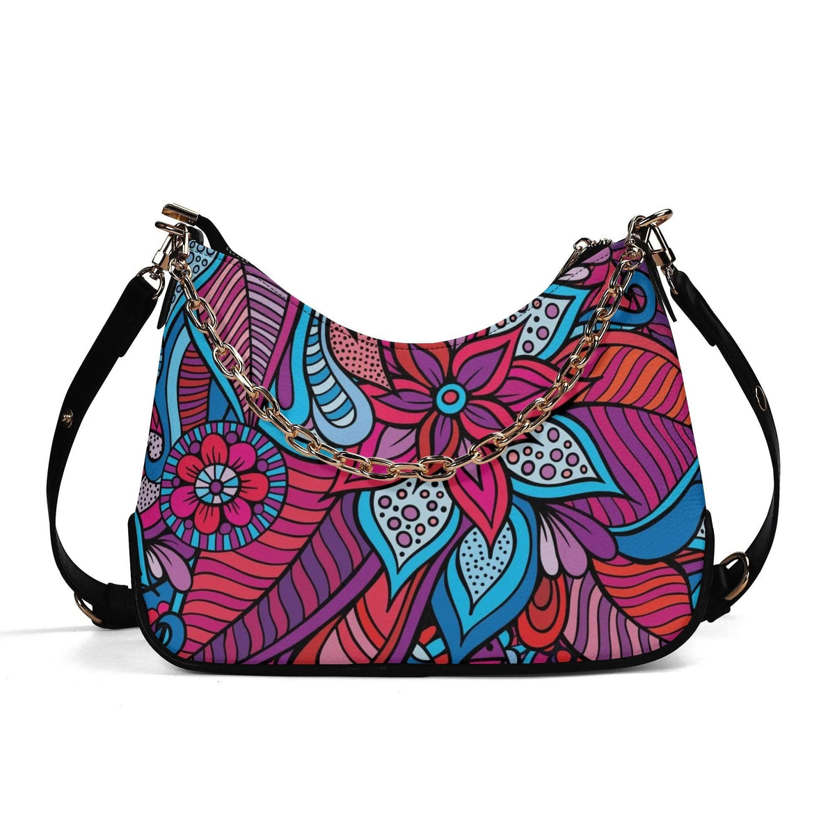 Vibrant floral bohemian chic shoulder bag with bold pink, blue, and purple patterns and gold chain and black adjustable strap