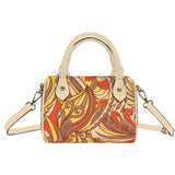 Miarna Mini Boston Satchel Bag with vibrant orange, yellow, and brown abstract print with retro floral vibes, cream handles, and detachable shoulder strap. Blissfully Brand