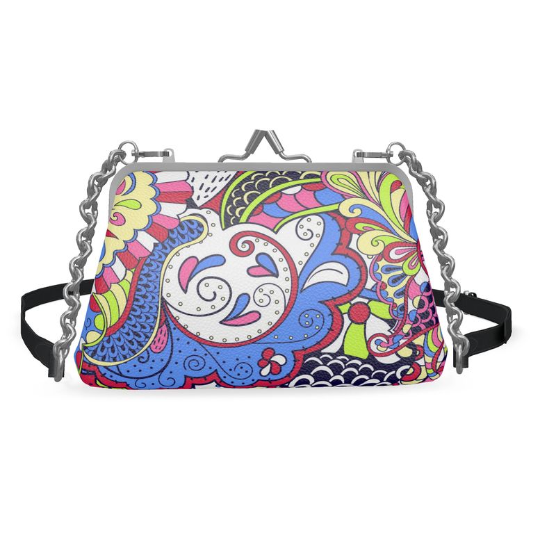 Handmade Sechia leather crossbody bag featuring a vibrant, multicolored paisley design with adjustable strap and chain, clasp closure and flat frame. Made in London, England. Blissfully Brand