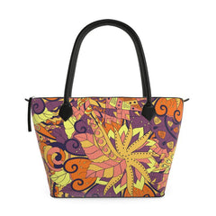 Vibrant Aki zip top large leather tote bag with psychedelic autumn leaf pattern in yellow, orange, and purple on textured Nappa leather - Blissfully Brand