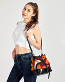 A stylish canvas bucket bag featuring a vibrant retro-inspired geometric print in burgundy, orange, black, and cream. The bag has a drawstring closure with black rim and straps. The bottom portion is solid black, creating a modern color-blocked effect. This versatile shoulder bag combines bold vintage flair with contemporary design, perfect for making a fashion statement while remaining functional for everyday use