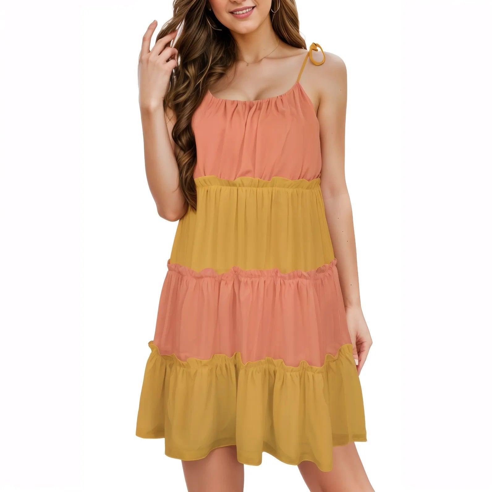 Sleeveless tiered sundress in coral and mustard color blocks, featuring spaghetti straps , smocked back and gathered tiers for a flowy summer look