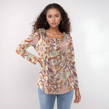 Women's boho chic long-sleeve top with vibrant eclectic patterns in pastel and bold colors