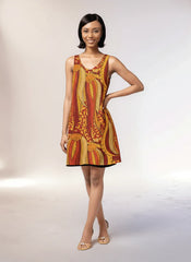 Ame reversible dress by Blissfully Brand in bold orange and yellow abstract pattern. Versatile sleeveless design, black reversed solid, perfect for any occasion