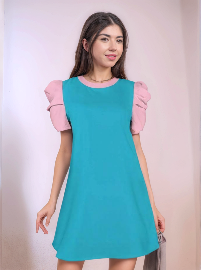 Retro Chic Teal cocktail dress with blush pink puff sleeves and a keyhole back detail. The dress is knee-length and fits loosely. - Blissfully Brand