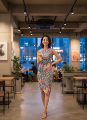 Arane asymmetrical statement dress in vibrant pink, blue, and green abstract floral pattern by Blissfully Brand, perfect for bold and confident Retro Chic fashionistas