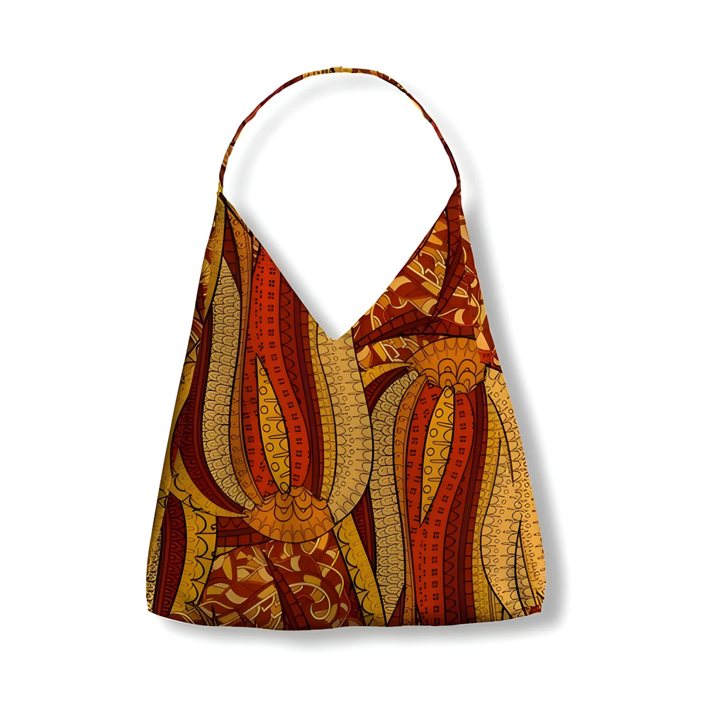 Vibrant Ame print canvas tulip bag with African-inspired tribal patterns in orange, yellow, and brown tones, featuring a single strap and unique abstract design - Profonde by Blissfully Brand
