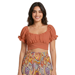  Flame Pea Orange puff sleeve crop top with open tie back and ruched bust, styled with Binka print wide-leg pants — Blissfully Brand made-to-order fashion