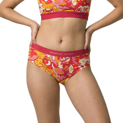 Blissfully Brand Decora Print Cheeky Brief in bold Torch Red, Tree Poppy Orange, and Papaya Whip psychedelic floral print with crimson branded waistband, styled as a coordinated set with matching scoop bralette 