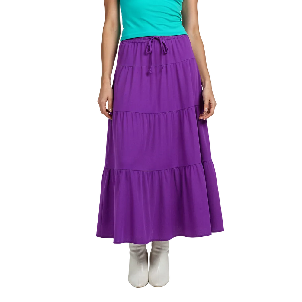 Vibrant Electric Violet Pleated Tier Maxi Skirt from the Core Essentials Series, featuring a flowy, tiered design, bamboo-like texture, and front tie. Blissfully Brand