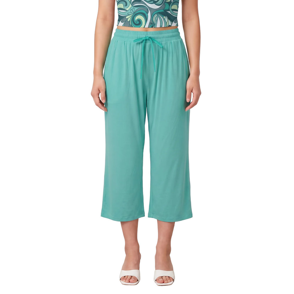 Woman wearing Puerto Rico Green wide-leg capri pants with Persian Green drawstring tie and Mima print tube top - Blissfully Brand Solid Series
