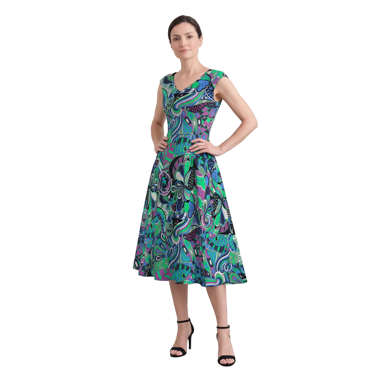 Woman wearing Nela print emerald and cobalt fit and flare midi dress with pockets, Profonde Collection by Blissfully Brand
